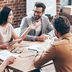 Colleagues collaborating during a meeting in an office setting.
