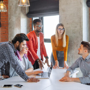 People having a discussion around a conference room table